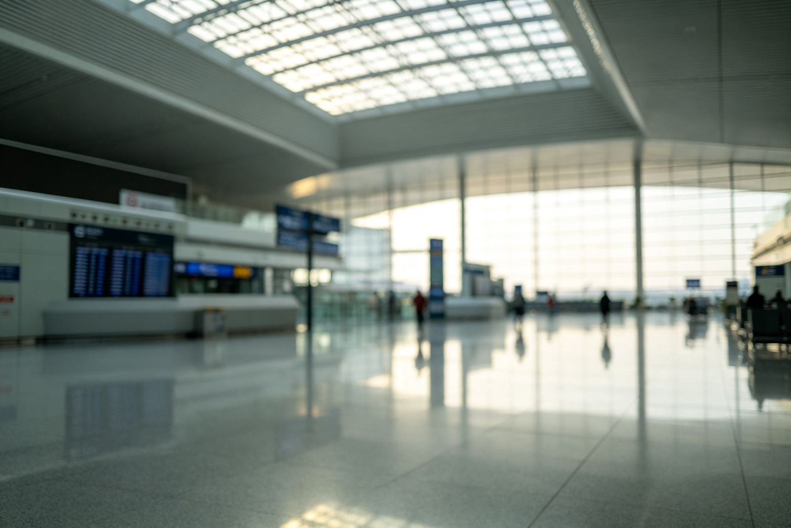 A modern Chinese airport transit hall with departure boards and an onward boarding pass